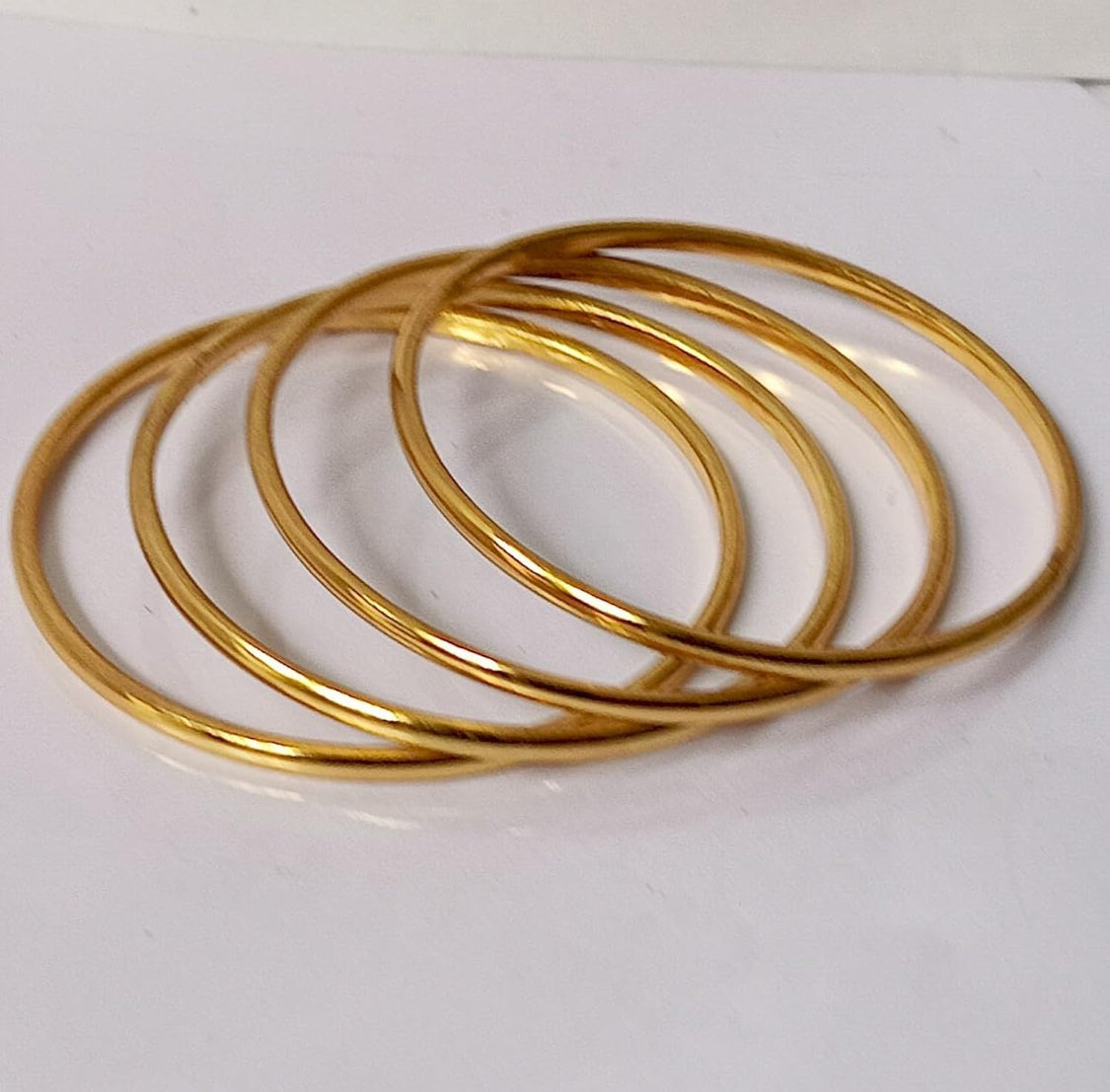 Buy Meraki Gold Thin Bangles