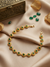 MERAKI Gold Plated Round Green Stone Mathapatti